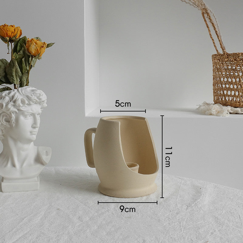 Textured ceramic vase on shelf