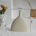 Matte minimalist ceramic vase with dried flowers