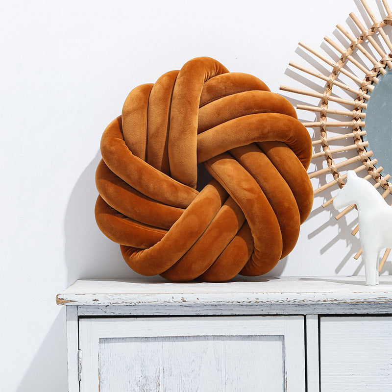 Plush knotted cushion in caramel