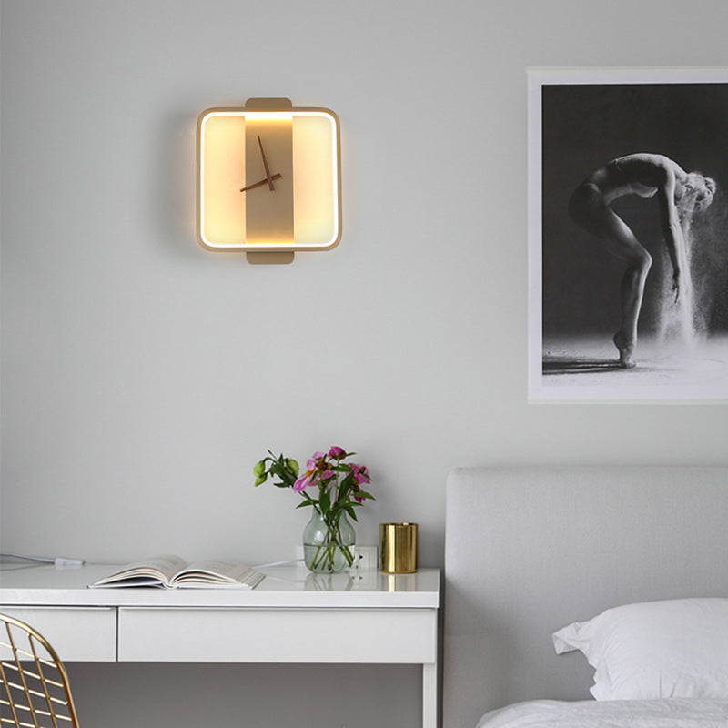Modern illuminated clock sconce for bedroom