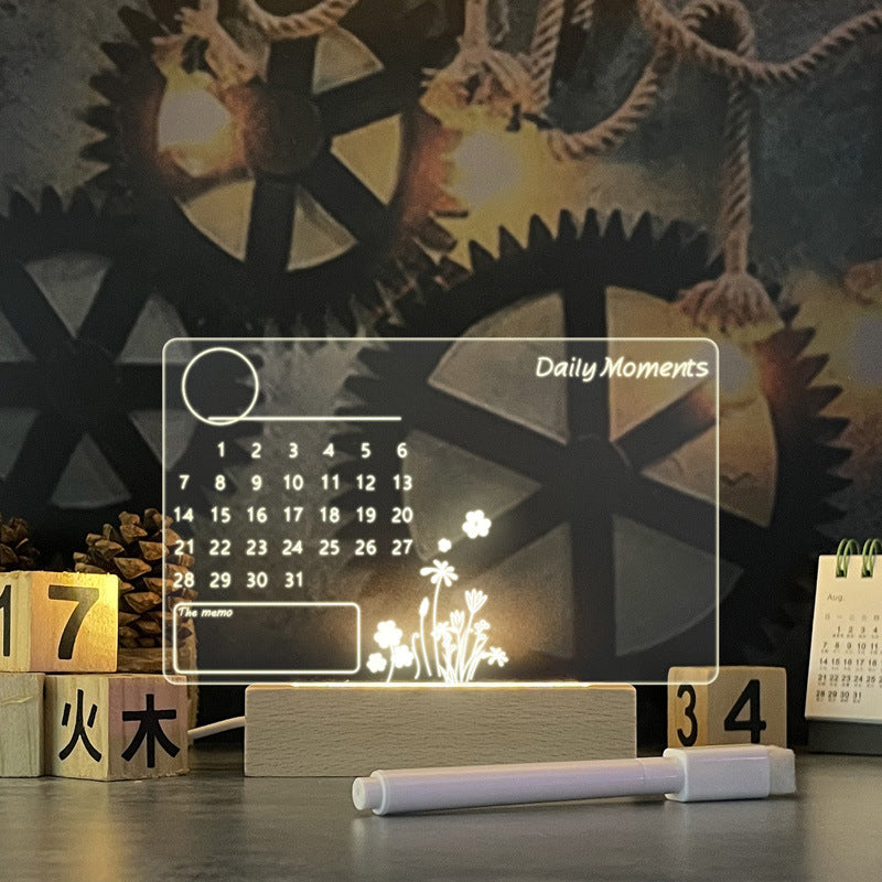 Clear message board lamp with pen on desk