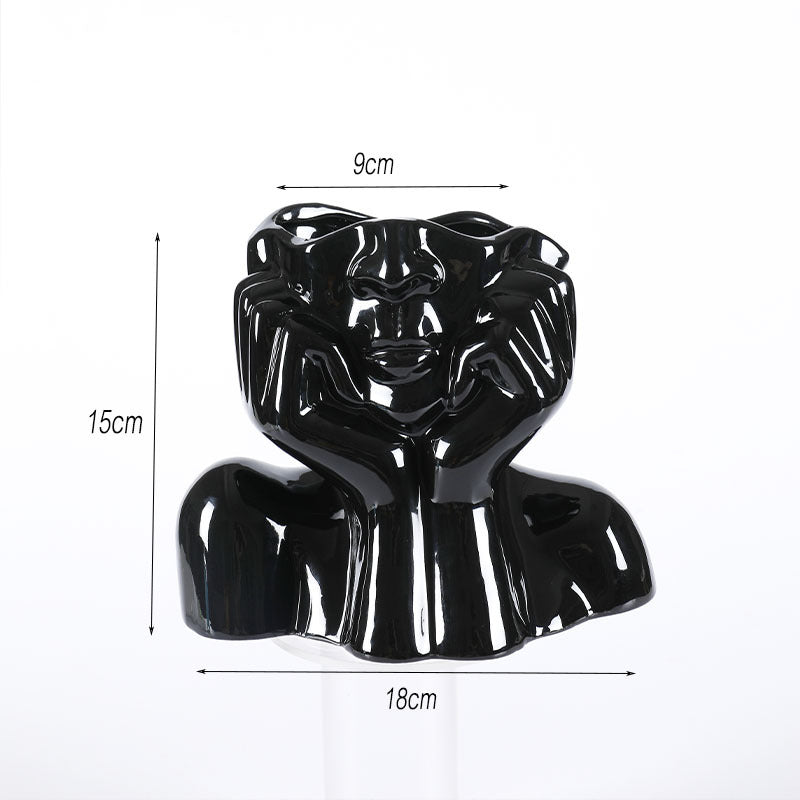 Abstract face ceramic sculptural vase