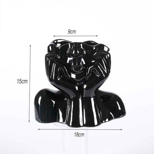 Abstract face ceramic sculptural vase