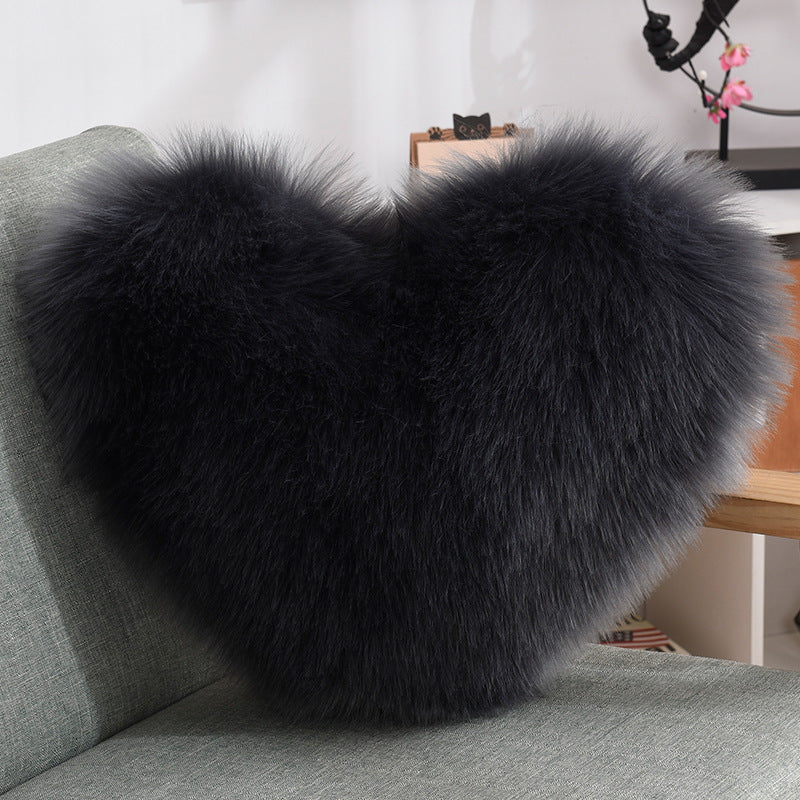 Fluffy heart cushion cover on sofa